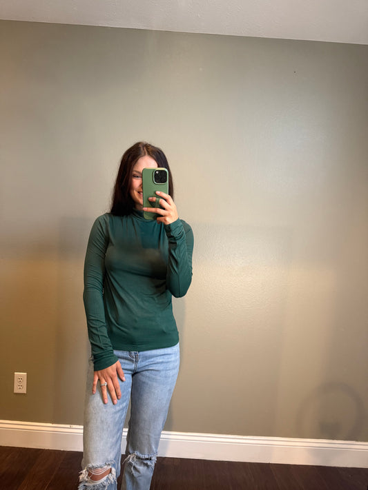 Green turtle neck top